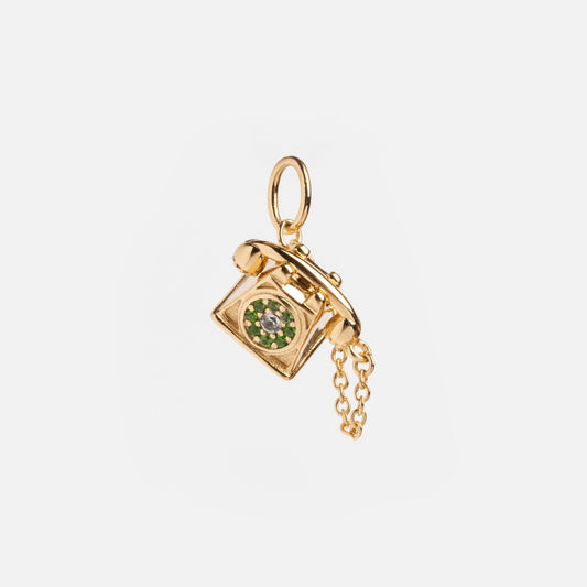The Vintage Inspired Trinket Charm is a gold vermeil piece shaped like a rotary phone, featuring a green gem on the dial and a small gold chain on the receiver, shown against a plain white background.