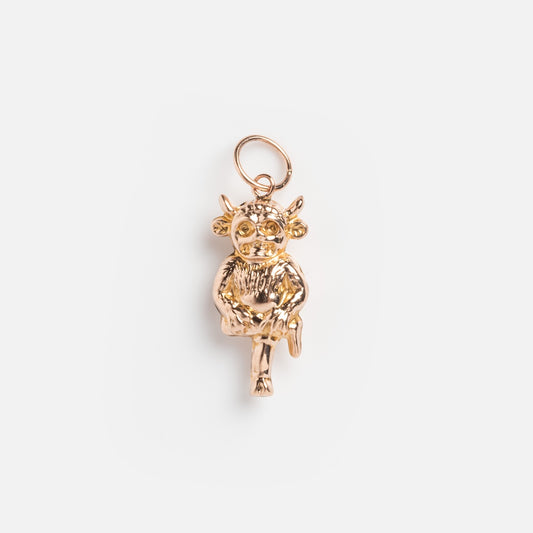 The Vintage 9k 1920s Lincoln Imp Charm is a whimsical yellow gold piece shaped like a horned creature sitting cross-legged, detailed facial features, and a round loop for chains—a unique find for vintage jewelry lovers.