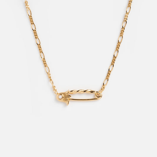 The Sonnet Safety Pin Charm Holder Necklace features an ornate, period-inspired pendant with a small clear gemstone accent on one end, shown on a white background.