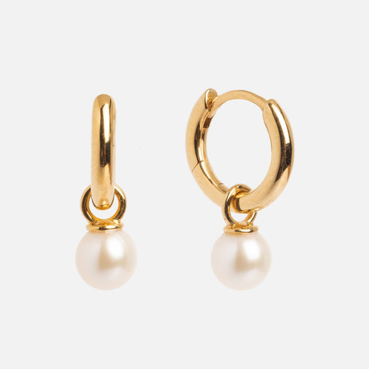 Pearl Keepsake Huggie Hoops: gold vermeil earrings with a freshwater pearl elegantly dangling from each small hoop, displayed on a plain white background.