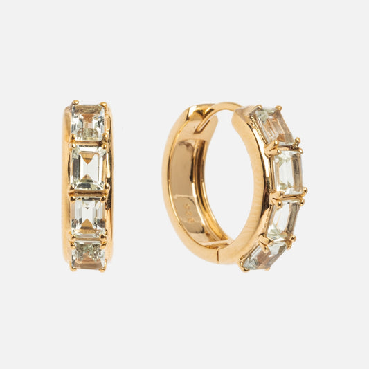A pair of Green Amethyst Era Huggie Hoops, each featuring three rectangular green amethyst gemstones in a row along the outer edge, displayed against a white background.