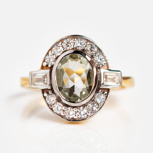 A close-up of the Oval Deco Green Amethyst and CZ Ring gleams in gold vermeil, reflecting the elegance of Art Deco style.