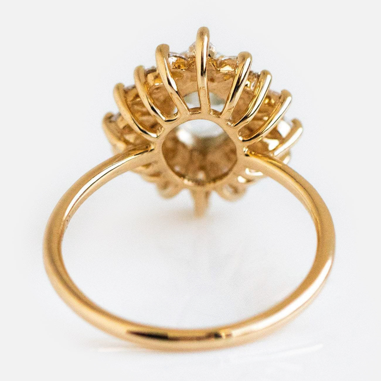 A close-up of the Lana Ring with Aquamarine & CZ in 14k solid gold shows its raised, intricate basket setting and central gemstone, photographed against a white background.