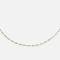 The Solid Gold Chain for Charms features small, evenly spaced oval links in a delicate design, shown against a plain white background—an ideal choice for a timeless charm necklace.