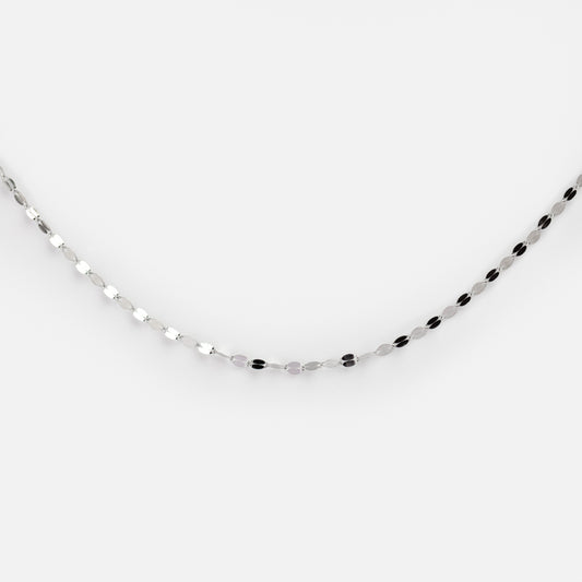 The Solid Gold Sparkle Link Chain, featuring small oval-shaped links with a delicate shine, is displayed against a plain white background.