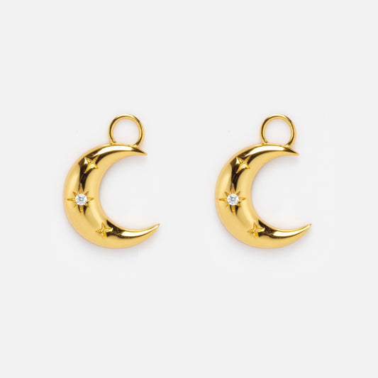 Two Earring Charms in 14k yellow gold plating, each shaped like a crescent moon with a small star and a clear gemstone in the center, are shown on a plain white background.