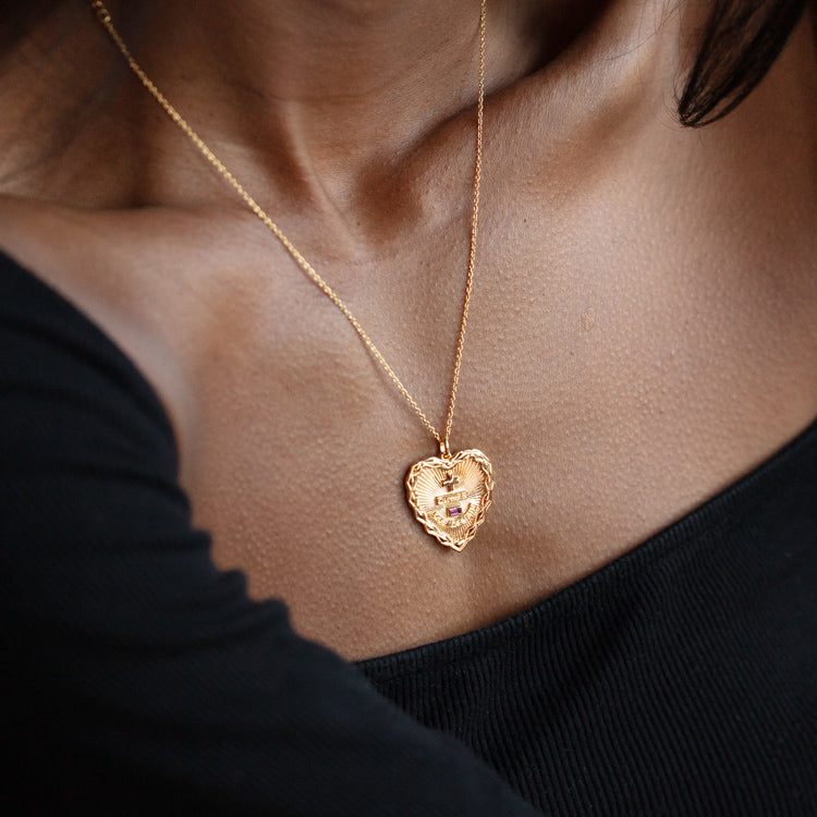 A close-up of a person wearing the Valentines Day Hearts and Flowers Gift Set, the delicate heart pendant resting on their chest. Paired with a black off-the-shoulder top, it’s perfect for showcasing your Valentine’s Day style.