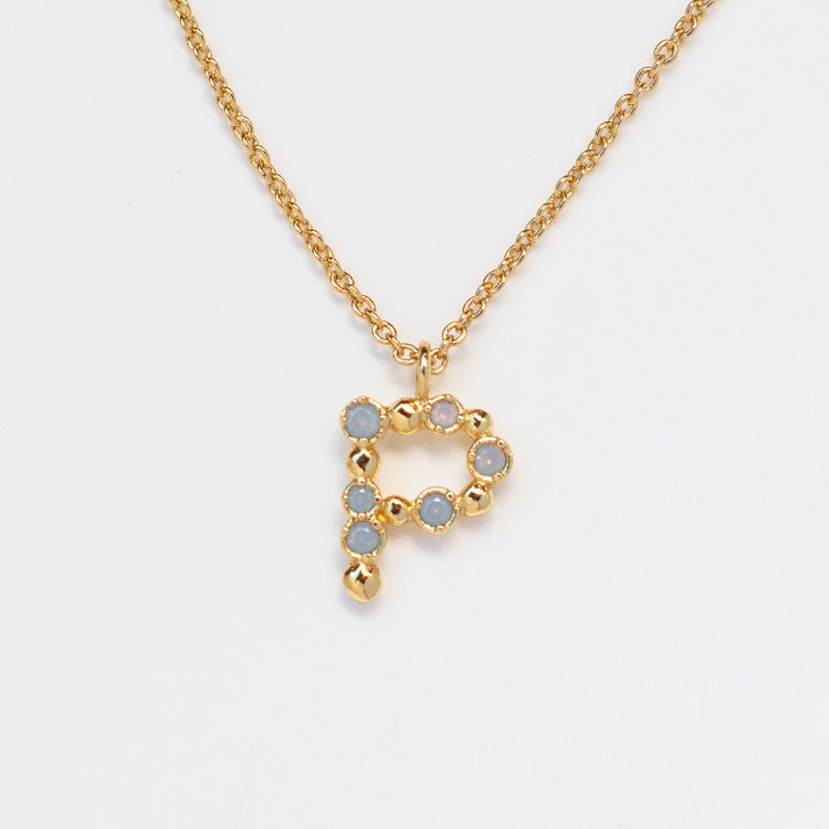 The Initial Charm Necklace Sample features a letter P pendant with opalescent nano gems set in gold bezels on a 14k yellow gold plated brass chain, beautifully showcased against a white background.