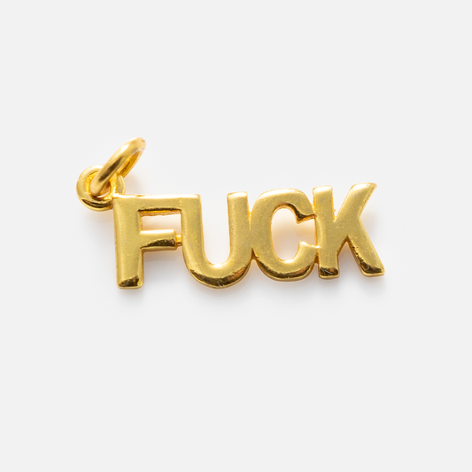 Charms by Anokhi Green: A gold-plated pendant featuring the word FUCK in bold capitals, with a loop for easy attachment—ideal to pair with your favorite cubic zirconia necklace.