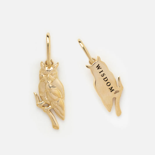 The Solid Gold Nature Charm features two detailed owl designs—one perched on a branch, the other engraved with “WISDOM.” Each gold charm has a loop, ideal for adding to spiritual jewelry creations.