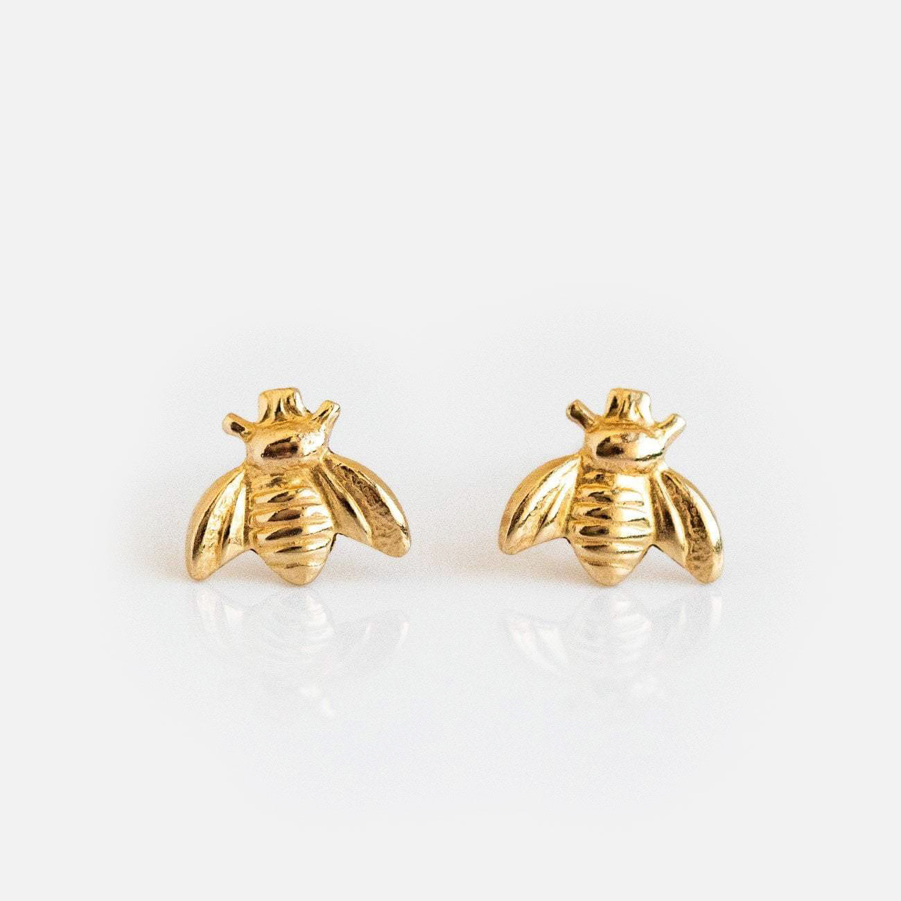 Golden Bee Earrings: Small, 14k gold filled stud earrings with detailed bumble bee wings and bodies, shown on a plain white background.