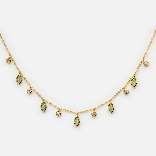 The Drops of Spring Opal Necklace is a 14k gold plated layering piece with alternating round diamonds and marquise green opal gems spaced along a fine chain, shown on a plain white background.