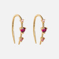 Solid Gold Ombre Birthstone Ear Huggers feature three pink and red gemstones in a vertical line on each curved earring, shown against a white background.
