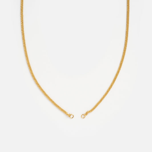 The Perfect Start Charm Holder Necklace, a thin gold plated chain with a simple clasp, lies open against a white background—ideal for displaying your favorite charms or charm clips.