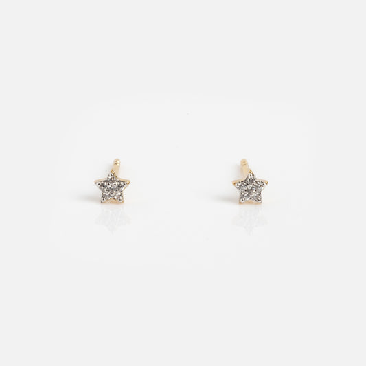 The Sparkle Star Studs Sample features small gold star-shaped earrings encrusted with tiny clear crystals, shown against a plain white background.