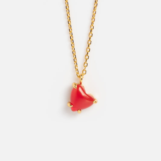 The Limited Edition Full Heart Necklace Sample is a 14k gold plated chain with a red agate heart pendant, accented by small gold prongs at each corner and shown on a plain white background.