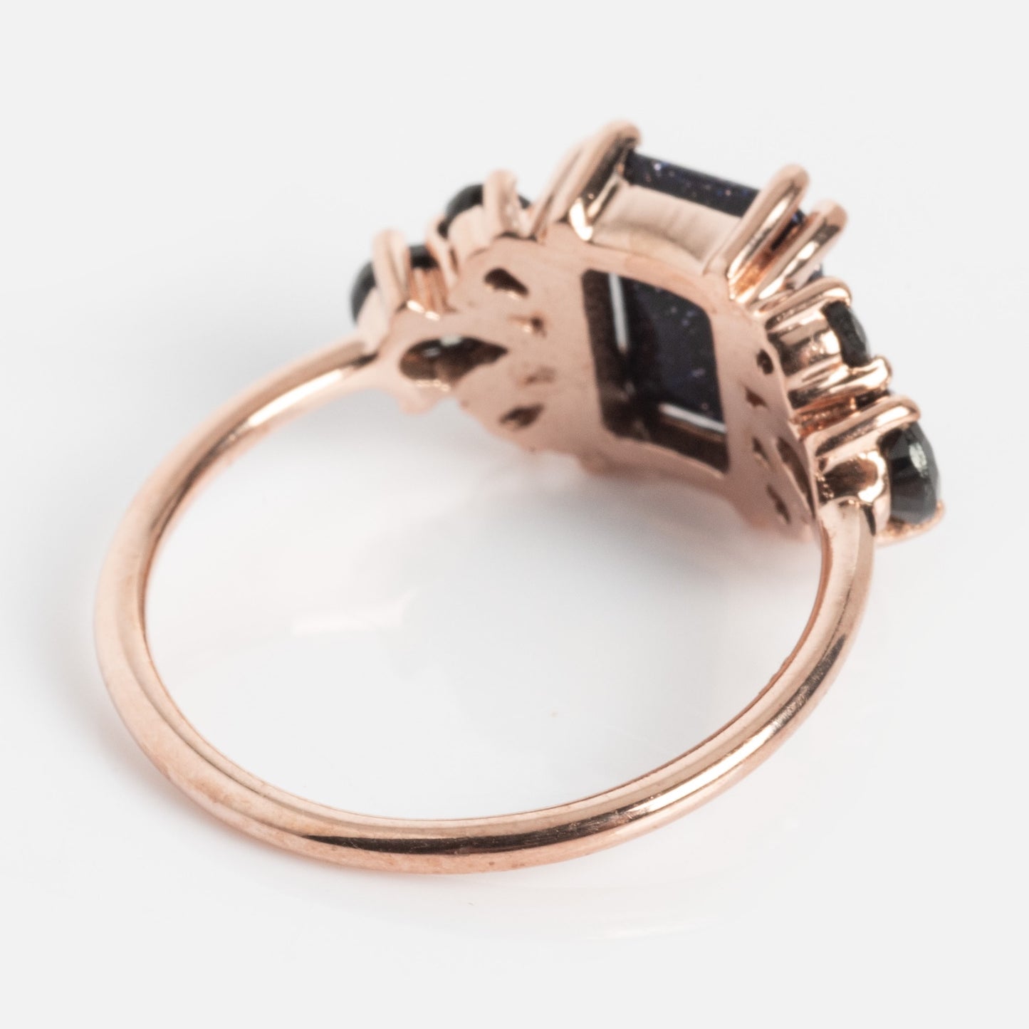 A close-up of the Gemstone Empress Ring, showcasing its intricate details and a shimmering labradorite stone.