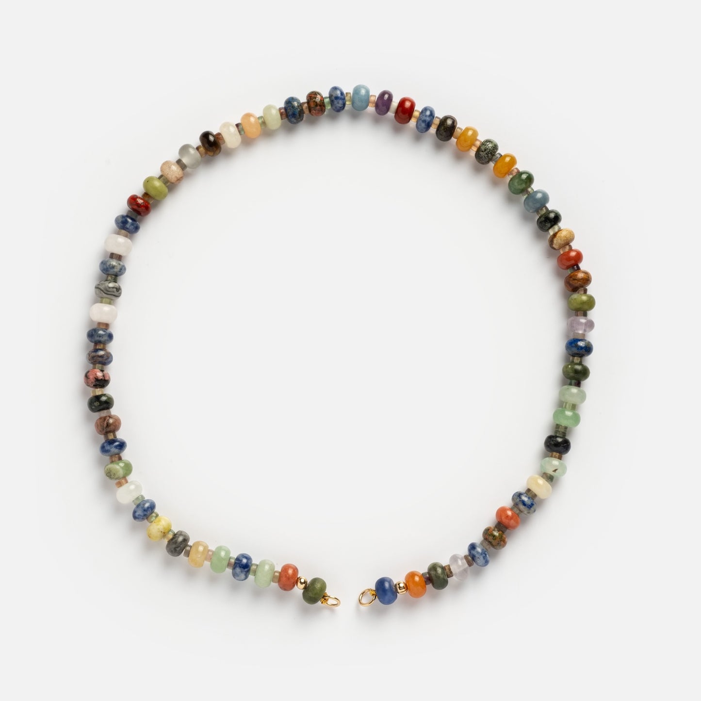 The Macey Customizable Beaded Charm Holder Necklace features small, round beads in blue, green, red, yellow, and white arranged in a random pattern, finished with a gold clasp.