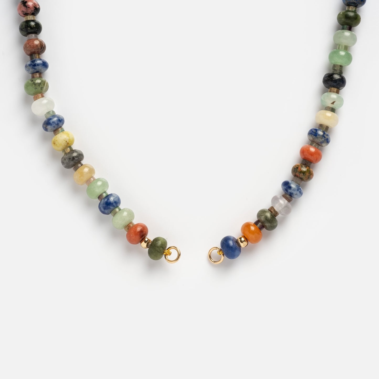 The Macey Customizable Beaded Charm Holder Necklace features vibrant round stones and a gold clasp. Displayed open to show the clasp ends, it is photographed against a plain white background.