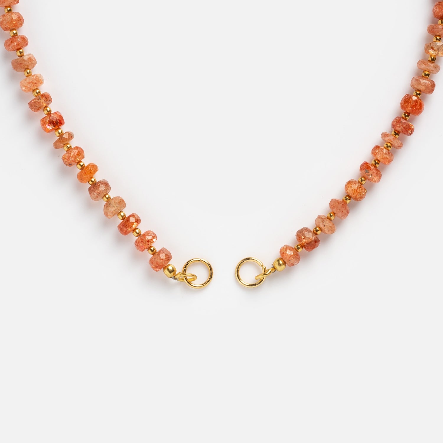 A close-up of the Customizable Beaded Gemstone Charm Holder Necklace with orange and gold beads and gold lobster claw clasps, shown on a white background.
