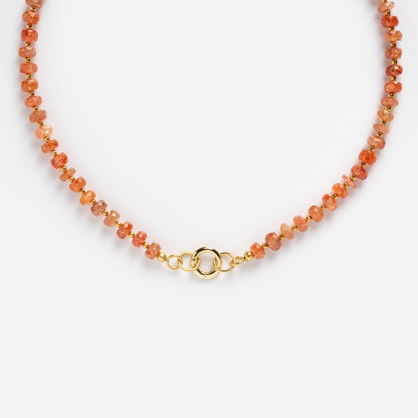 Close-up of the Customizable Beaded Gemstone Charm Holder Necklace, featuring small round orange gemstones and a gold clasp, displayed on a white background.