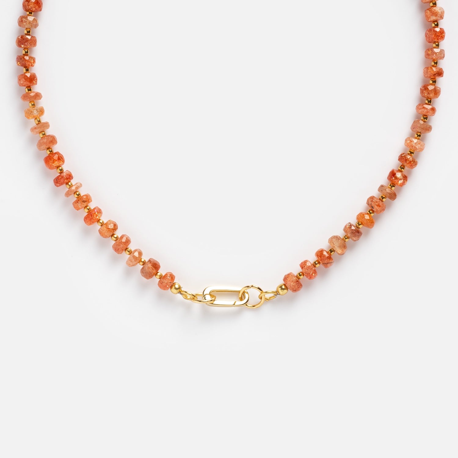 The Customizable Beaded Gemstone Charm Holder Necklace features small round orange stones, gold spacer beads, and a central gold clasp, shown on a plain white background.