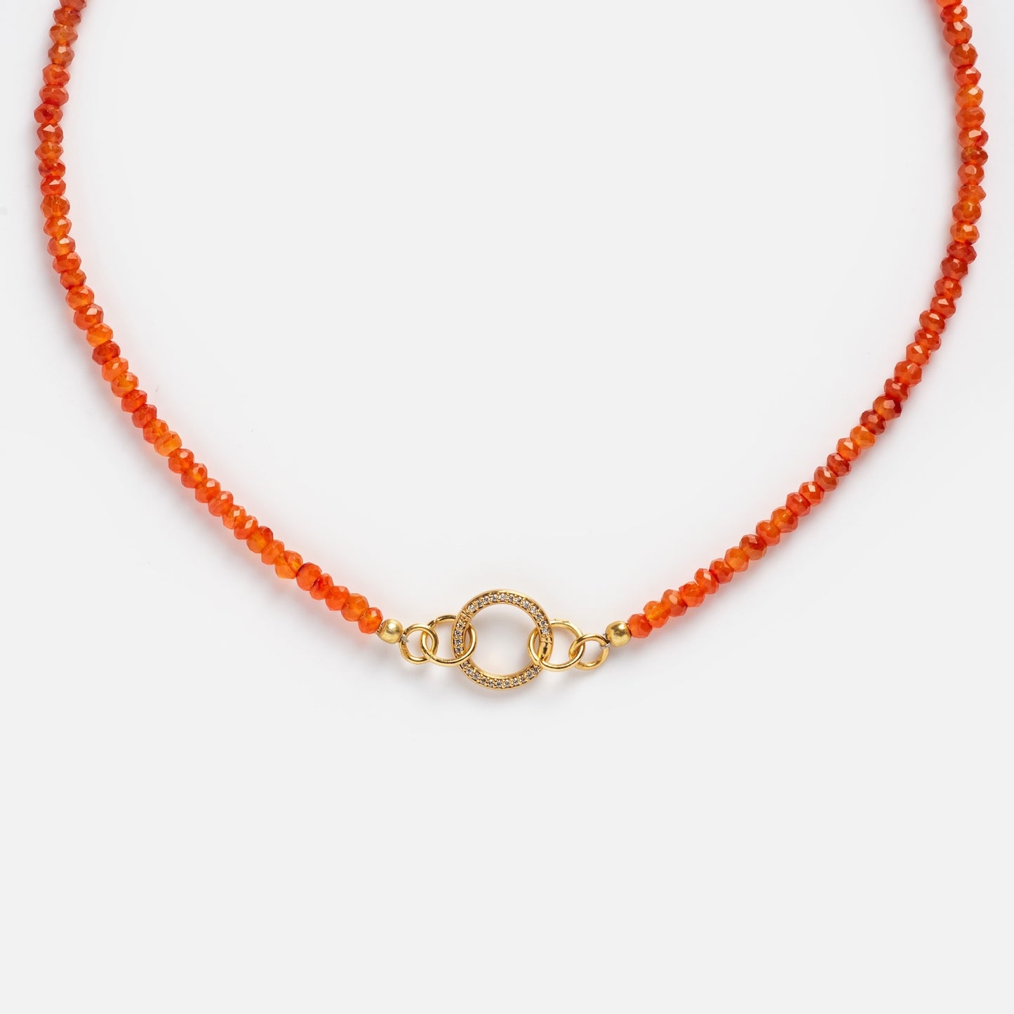 The Customizable Beaded Gemstone Charm Holder Necklace features orange beads and a central gold circular clasp with small clear stones and gold rings, displayed on a white background.