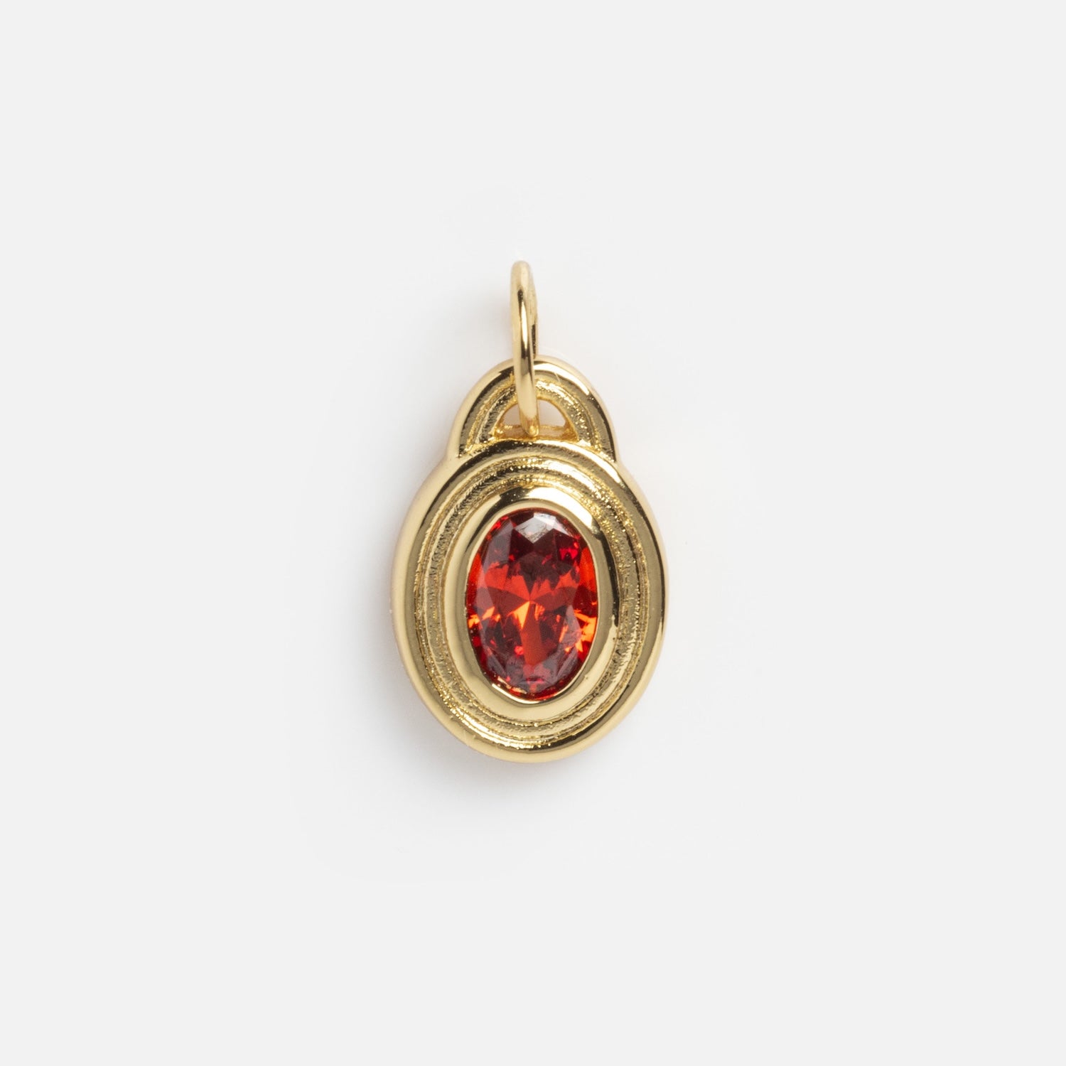 The Monroe Birthstone Charm is a gold pendant with a textured oval frame and a faceted, oval-shaped red gemstone at its center, shown against a plain white background.