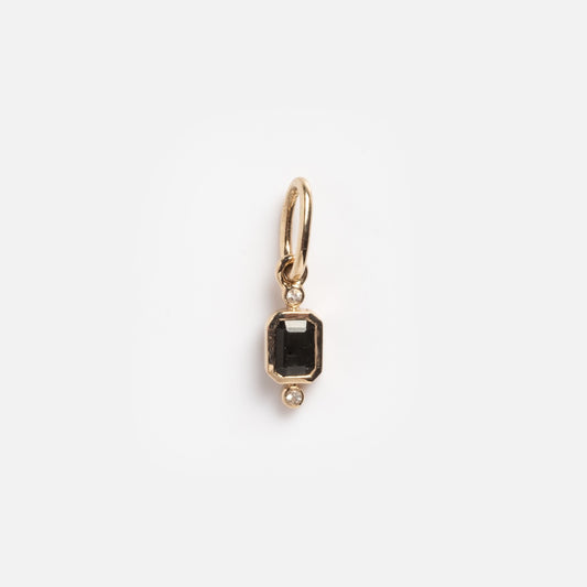 A Solid Gold Delicate Moonstone Drop Charm is shown against a plain white background, featuring a rectangular moonstone at the center with small round gems above and below.