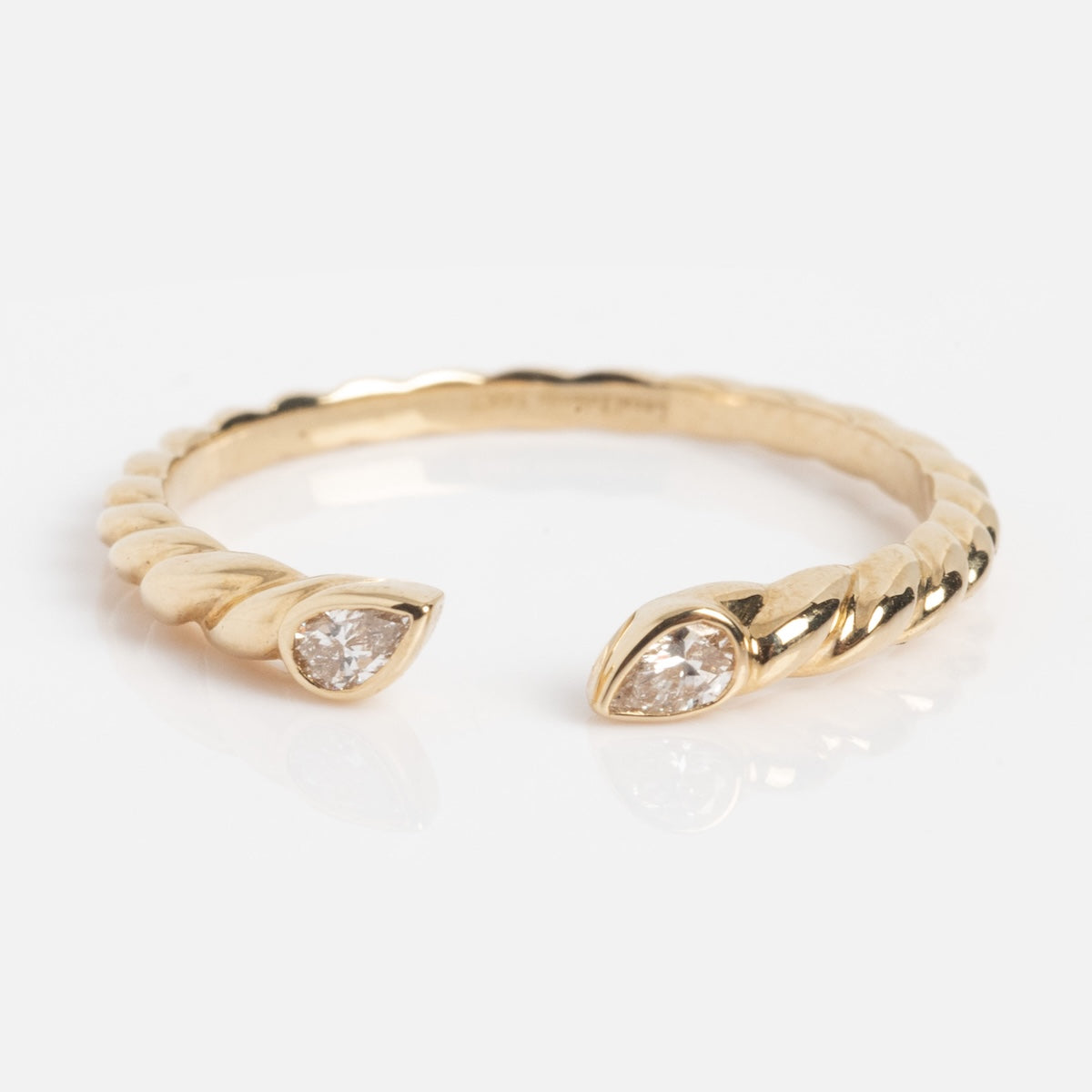 The Solid Gold Teardrop Open Band Sample Size 7 features a 14k yellow gold twisted open design with pear-shaped lab diamonds on each end, shown on a white background.