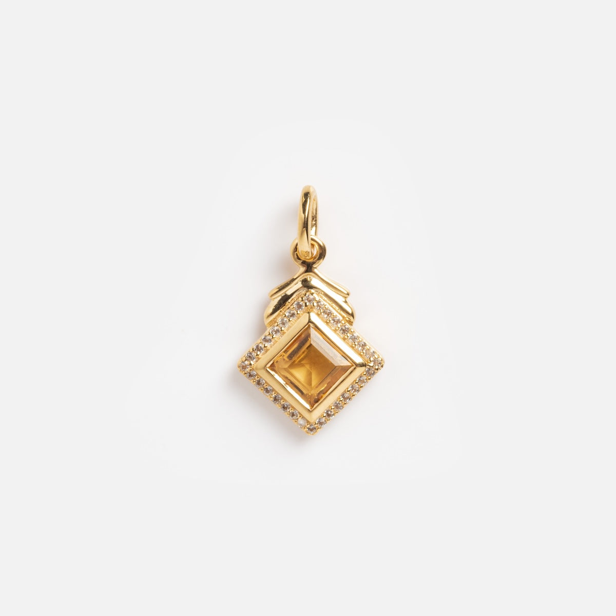 The Citrine and White CZ Vintage Inspired Charm features a square citrine center, bordered by sparkling white CZ stones and topped with a decorative bail, set against a plain white background.