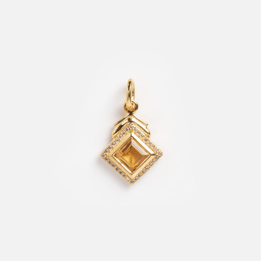 The Citrine and White CZ Vintage Inspired Charm features a square citrine center, bordered by sparkling white CZ stones and topped with a decorative bail, set against a plain white background.
