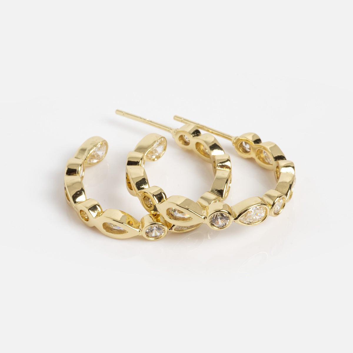 The Isla Hoops Sample features 18k yellow gold plated hoop drop earrings with a linked chain design and sparkling simulated diamond gemstones set in some links, shown on a white background.