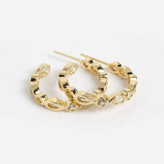 The Isla Hoops Sample features 18k yellow gold plated hoop drop earrings with a linked chain design and sparkling simulated diamond gemstones set in some links, shown on a white background.