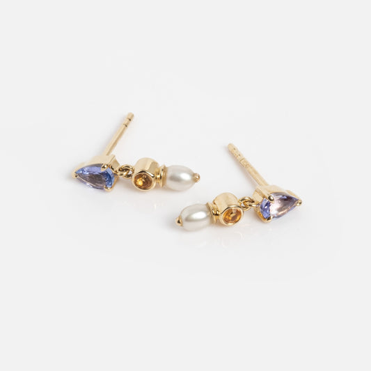 Solid Gold Citrine Tanzanite and Pearl Drop Studs 1 Sample: a pair of gold stud earrings with teardrop-shaped tanzanite, round freshwater pearl, citrine accents, and a dainty linear design.
