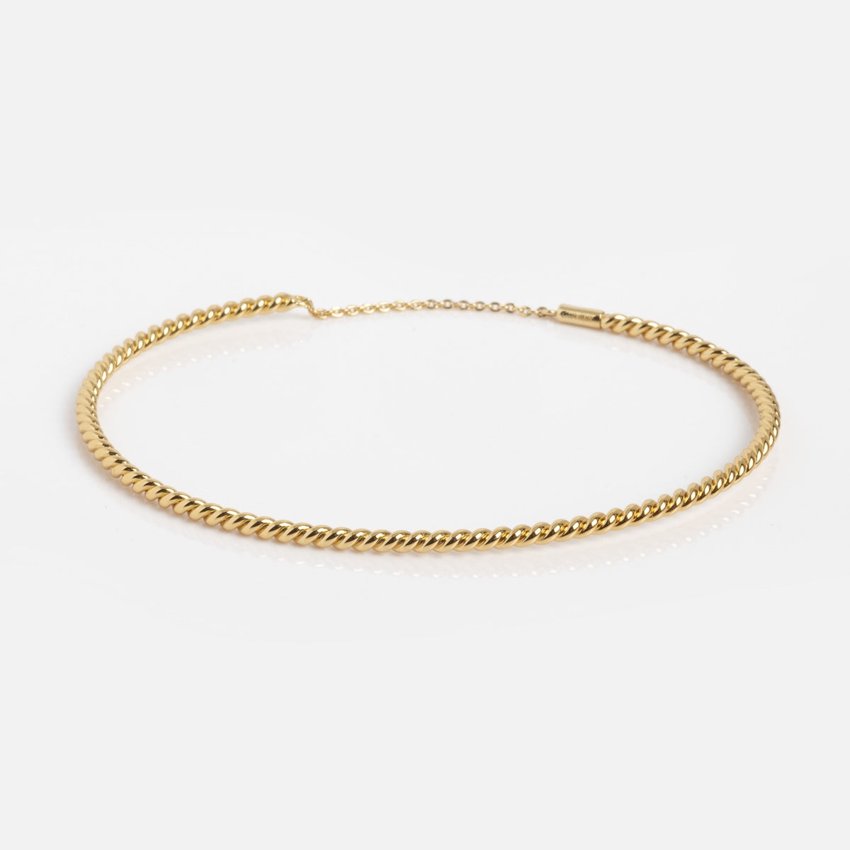 The Twisted Brass Bangle Sample features a twisted rope design and measures 50MM in inner diameter, shown on a plain white background for versatile styling.