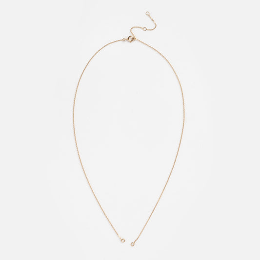 The Solid Gold Perfect Start Charm Holder Delicate Rolo Chain Sample features a small clasp and adjustable extender, displayed in a teardrop shape on a white background.