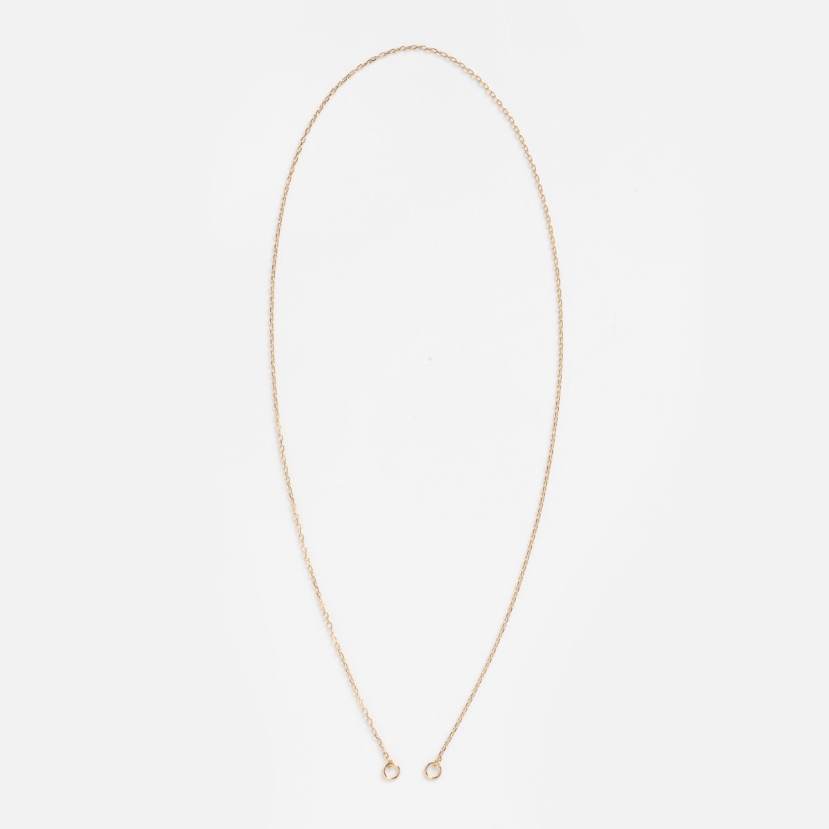 The Solid Gold Perfect Start Charm Holder Tiny Paperclip Chain Sample is a delicate 16-inch necklace crafted from 9k solid gold with small round clasps, shown against a plain white background.
