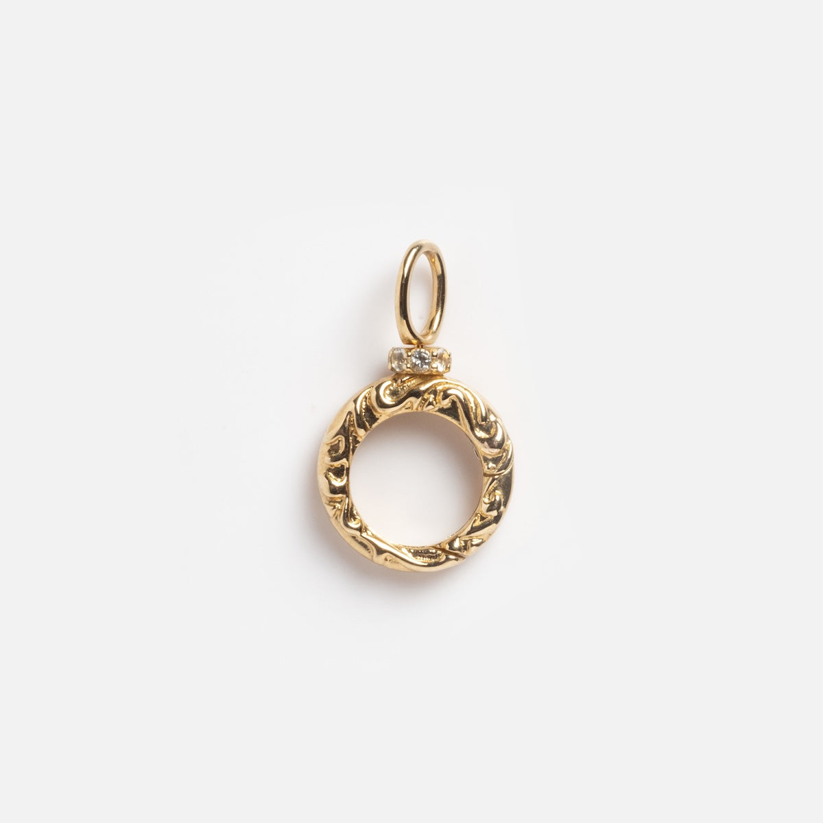 The Solid Gold Textured Round Charm Clip Sample features intricate engraving and a small top loop for attaching to a chain, shown on a plain white background.