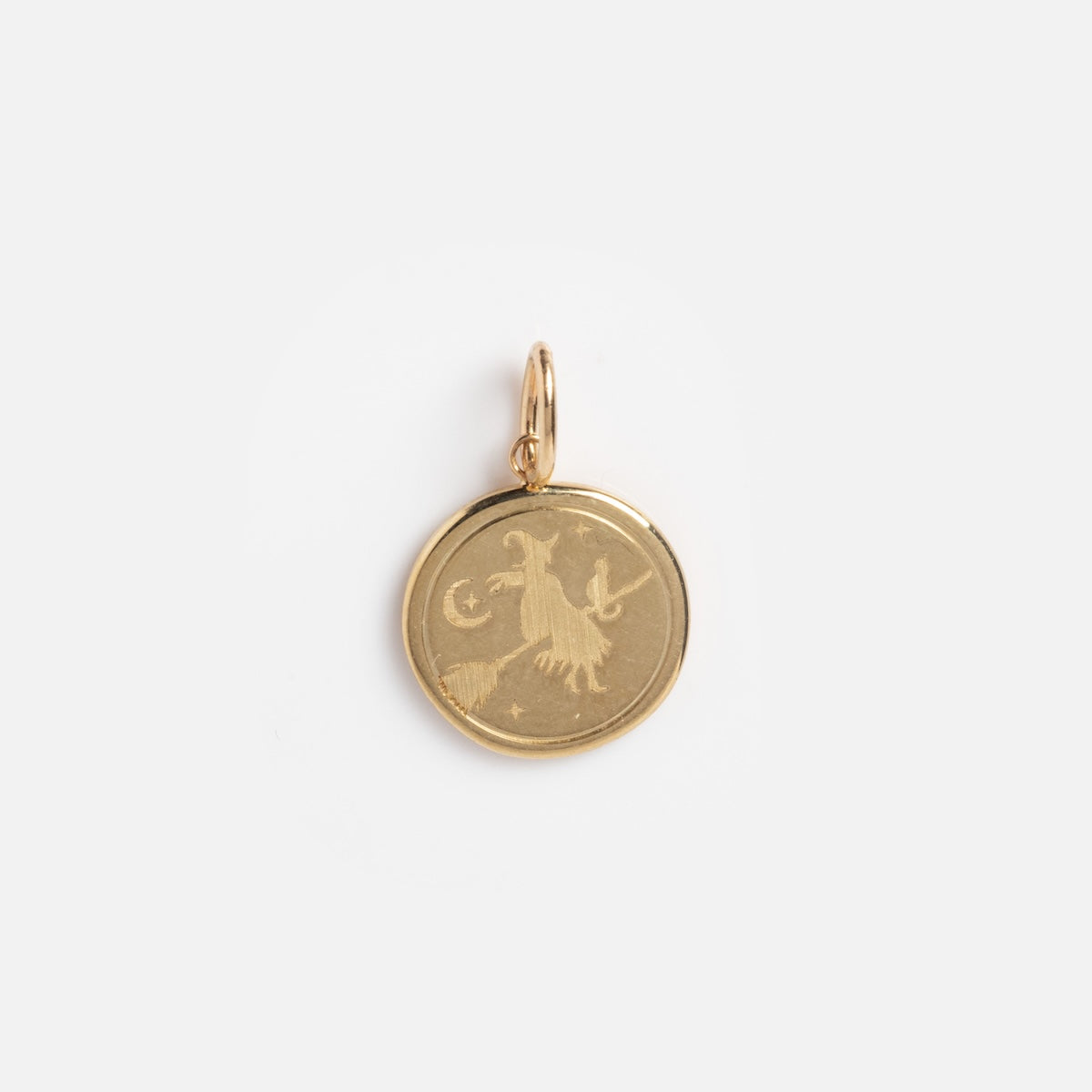 The Solid Gold Spooky Witch Coin Charm Sample features an engraved goat, crescent moon, and stars on a gold round pendant against a white background.