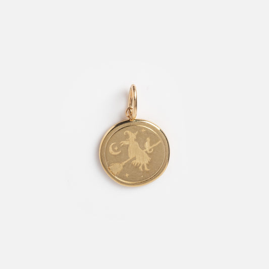 The Solid Gold Spooky Witch Coin Charm Sample features an engraved goat, crescent moon, and stars on a gold round pendant against a white background.