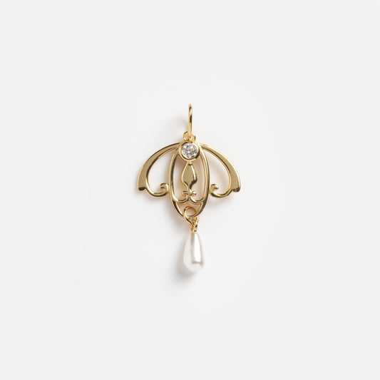 The Art Deco Open Work Pearl Drop Charm Sample is a gold pendant with an ornate, symmetrical design, featuring a round clear gemstone at the top and a teardrop-shaped white pearl drop at the bottom.