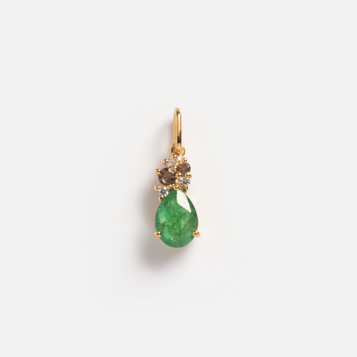 The Emerald Cluster Charm Sample is a gold pendant with a teardrop green gemstone and two small round white stones above it, shown on a plain white background.