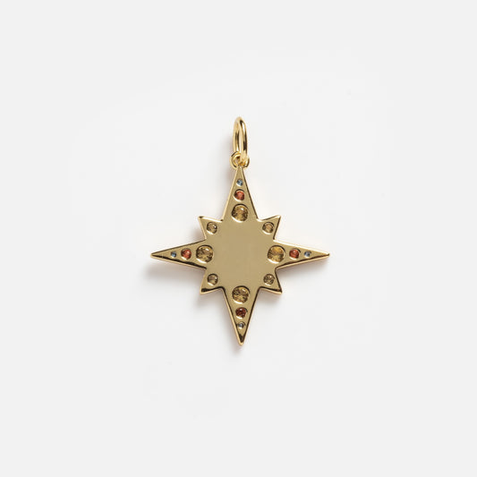 The Solid Gold Large Celestial Star Charm Sample is an eight-pointed gold star pendant with small round gemstones and a top loop for attaching to a necklace, shown on a plain white background.