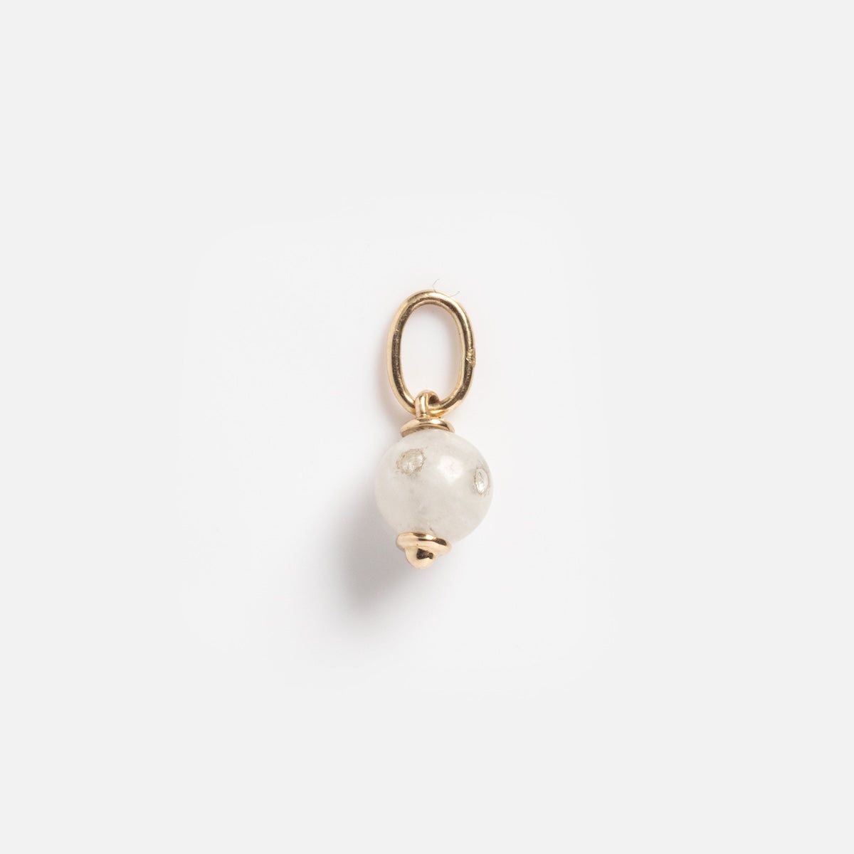 The Solid Gold Moonstone Gem Drop Charm Sample features a small gold charm with a round white moonstone bead and a gold loop, displayed on a plain white background.