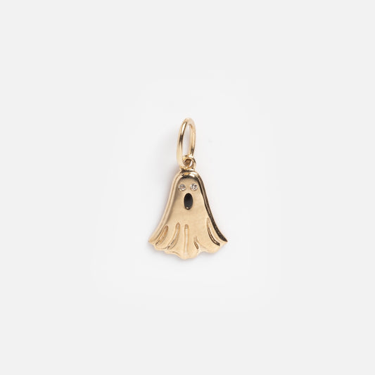 The Solid Gold Ghost Charm Sample features a ghost-shaped gold pendant with two sparkling eyes, a dark oval mouth, and a small loop, all displayed against a plain white background.