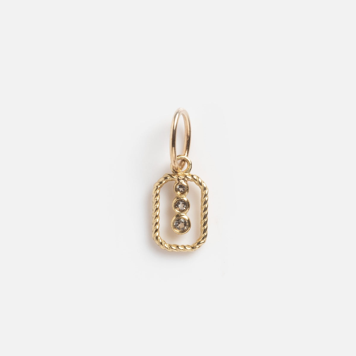 The Solid Gold Floating Topaz Drop Trio Charm Sample features a twisted rectangular gold frame with three vertically set round topaz gems, displayed against a plain white background.