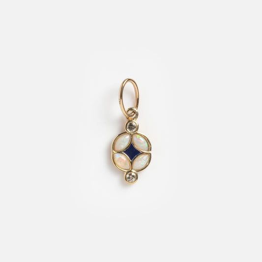 The Solid Gold Art Deco Opal Charm features a circular design with a central dark blue diamond-shaped stone, four oval opals, and two small round diamonds, displayed on a plain white background.