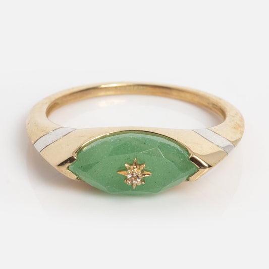 The Solid Gold Green Aventurine Evil Eye Ring Sample Size 7 features a marquise-shaped Green Aventurine center, a star-set tiny White Topaz, and a 9k yellow gold band with silver accents and a polished finish.