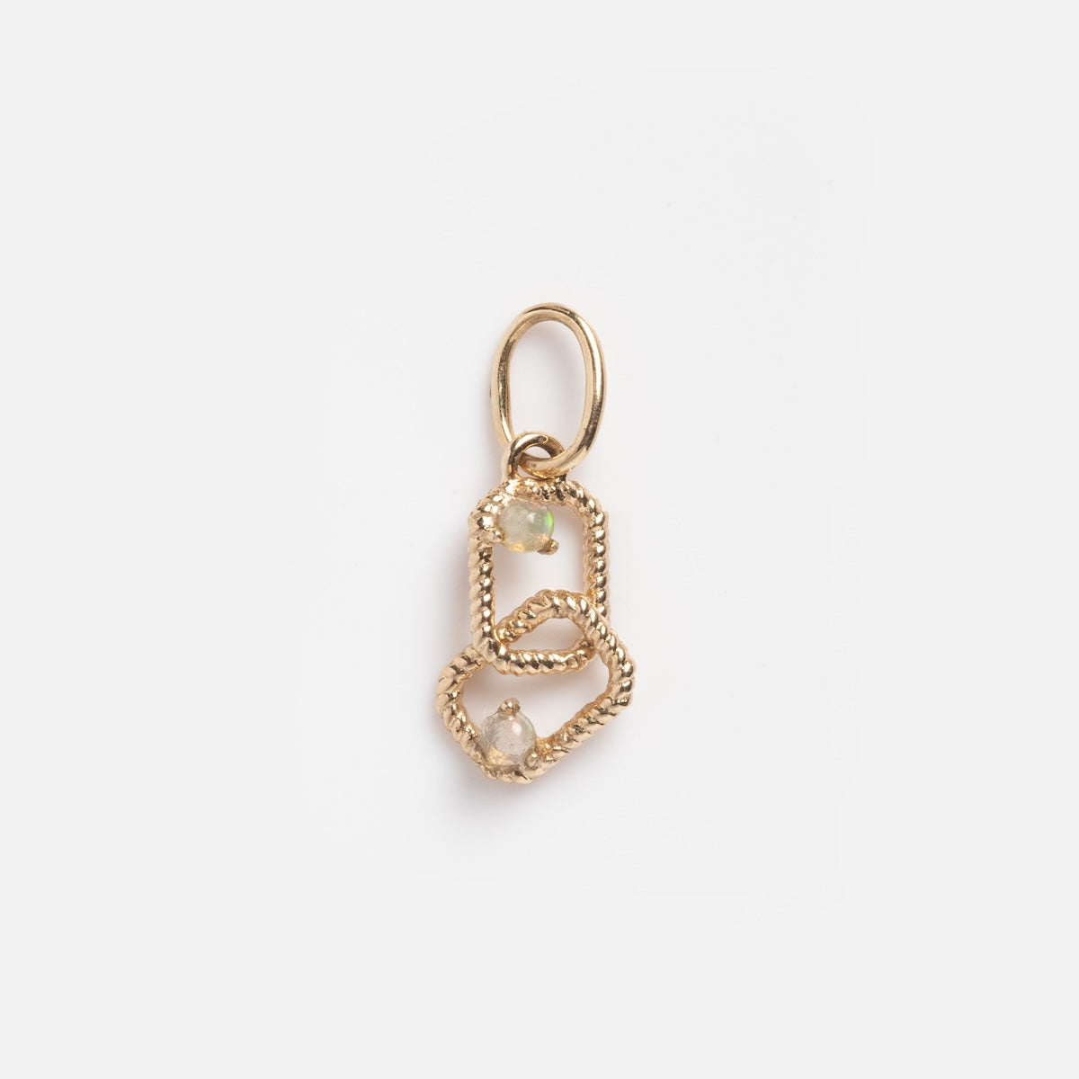 The Solid Gold Delicate Floating Opal Duo Charm Sample features two interlocking twisted gold loops, each adorned with a raw opal gemstone, suspended from a simple gold bail against a plain white background.